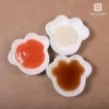 Shell-shaped porcelain sauce dish